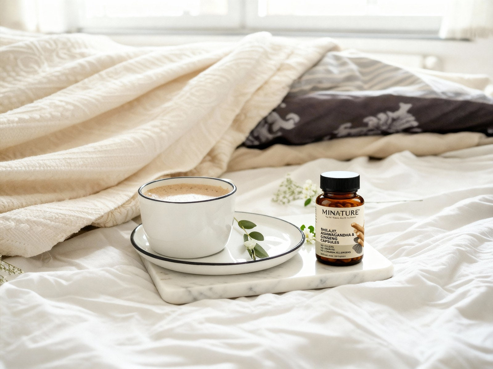 Minature Shilajit, Ashwagandha, Ginseng Capsules in bed with coffee