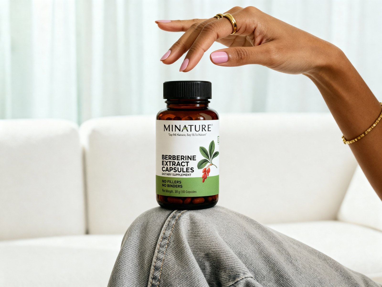 minature Berberine bottle in women's hand