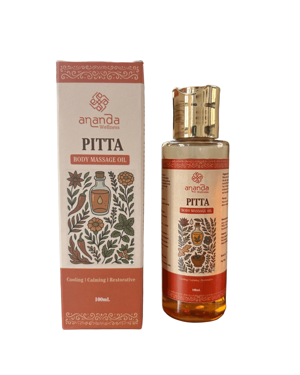 Ananda Pitta body massage oil bottle and packaging on a green background